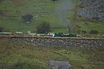 138 runs past the site of Glanrafon sidings, from the opposite side of the valley.       (17/09/2005)