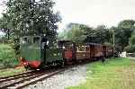 No 823 ‘Countess’ runs over the level crossing and into Castle Caereinion station   (24/08/2002)