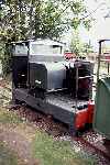 Simplex tractor No 10 ‘Ousel’ ticks over by Yaxham station   (04/09/1993)