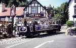 A more ornate livery was in evidence in 1994, car No 4 runs across the road and into Llandudno Victoria terminus.   (13/06/1994)